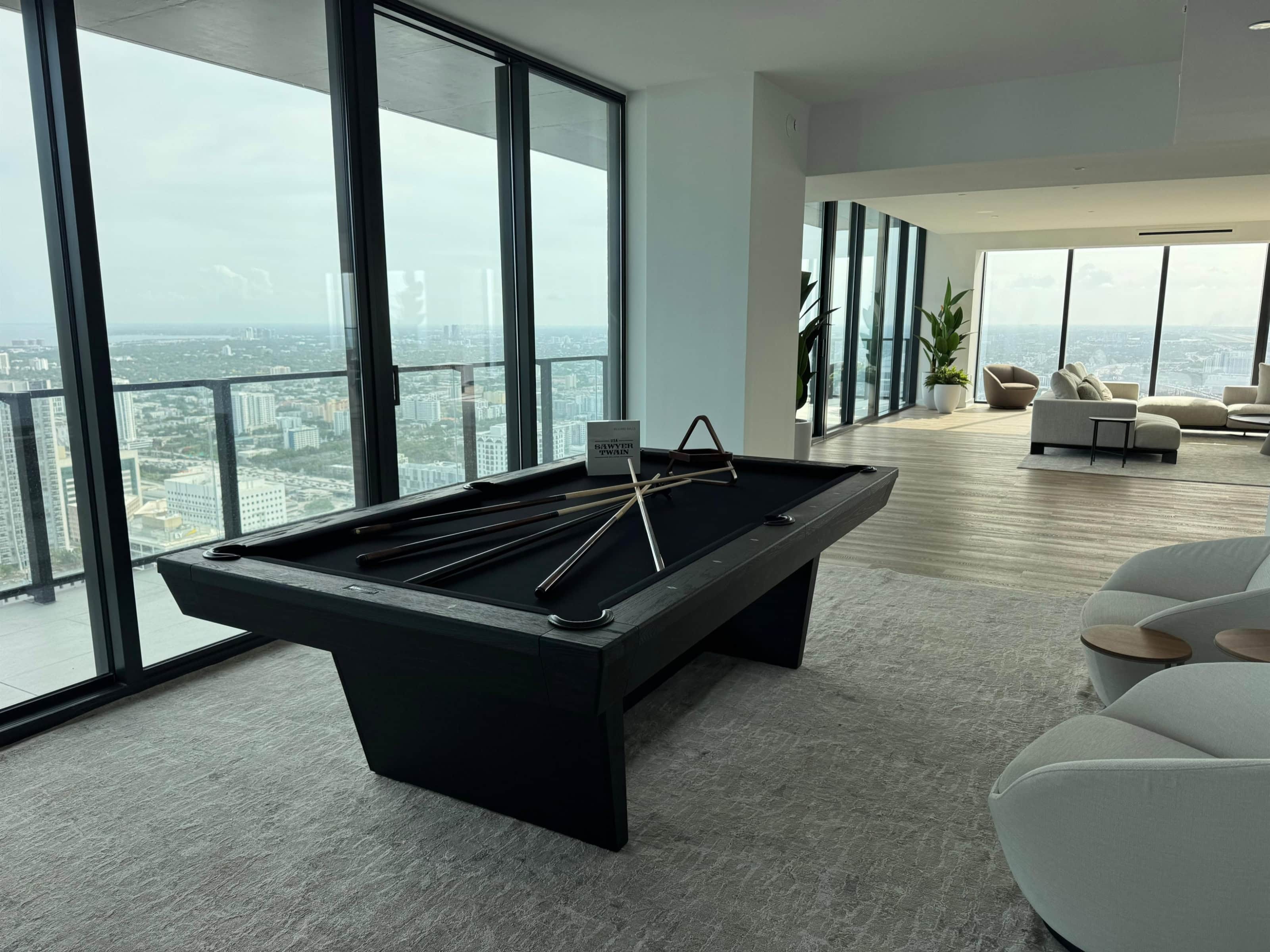 Kaci pool table in black ash installed in a high-rise residence